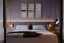 Nowoczesna sypialnia z łóżkiem, obrazami na ścianie i wiszącymi lampami.