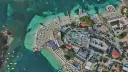 Albania najpiękniejsze miejsca: tętniący życiem kurort plażowy z białymi parasolami, turkusową wodą i basenami.