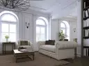 Elegancki salon z sofą, fotelem i książkami na półce.