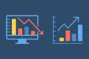 Dwa wykresy: jeden na monitorze z trendem spadkowym, drugi z trendem wzrostowym.
