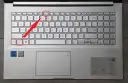 Klawiatura laptopa z zaznaczonymi klawiszami Fn+Esc i F6.