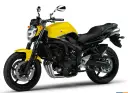 Jasnożółty motocykl Yamaha FZ6 z czarnym siedzeniem i detalami. Idealny do miejskiej dżungli.