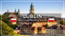 Widok na Lublin z charakterystyczną wieżą ratuszową i polską flagą.