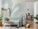 Miętowa kanapa i tapeta w stylu baby blue tworzą przytulną atmosferę.