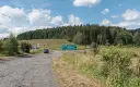 Droga DW389 z zielonym znakiem kierunkowym do Kudowy Zdroju, Niemojowa i Poręby.