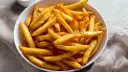 Złociste, chrupiące frytki z airfryera, idealne do szybkiego przygotowania. Dowiedz się, ile smażyć mrożone frytki w airfryer, by uzyskać perfekcyjny smak.
