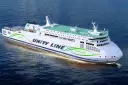 Nowy, biały prom "Unity Line" z zielonym napisem "Green Ship" płynie po wodzie.
