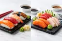 Dwa talerze z różnorodnym sushi i sashimi: łosoś, tuńczyk, krewetka, węgorz, biała ryba. Podane z wasabi i imbirem.