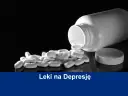 Białe tabletki rozsypane z butelki, symbolizujące leki na depresję. Dowiedz się, jak dostać leki na depresję.