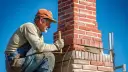 Ile kosztuje budowa komina z cegły? Sprawdź, co wpływa na ceny