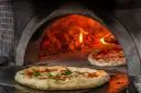 Descubre Pizzería Venecia: ¿La mejor pizza italiana en horno de leña?