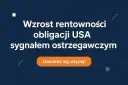 Niebieskie tło z białym tekstem: "Wzrost rentowności obligacji USA sygnałem ostrzegawczym" i pomarańczowym przyciskiem "Dowiedz się więcej!".