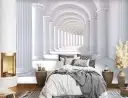 Sypialnia z fotorealistyczną tapetą przedstawiającą antyczny korytarz z kolumnami.