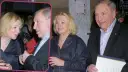 Barbara Stuhr w rozmowie z mężczyzną, oboje z kieliszkami w dłoniach.