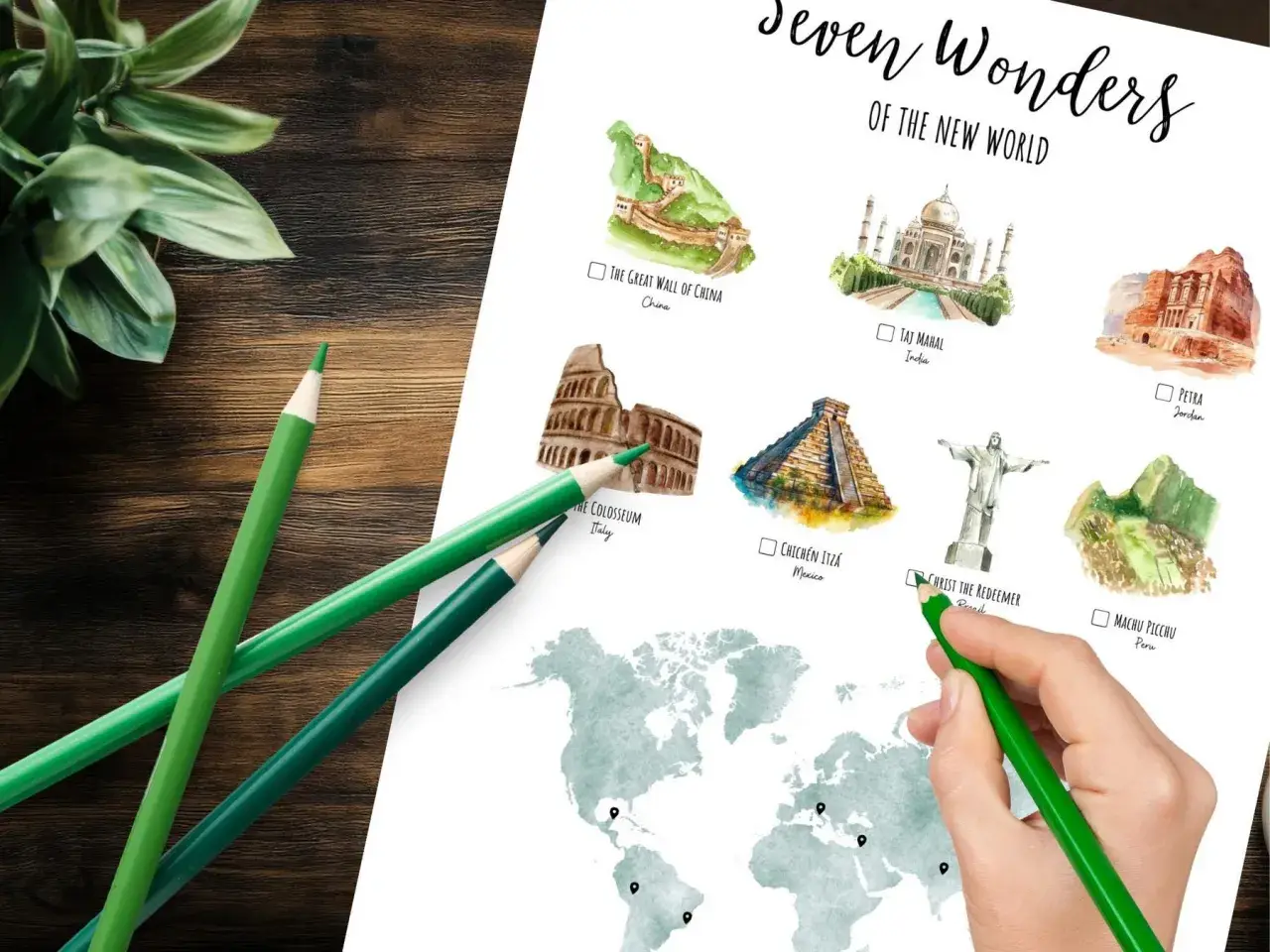 Ilustracje 7 cudów świata na mapie świata, zielone kredki i roślina.
