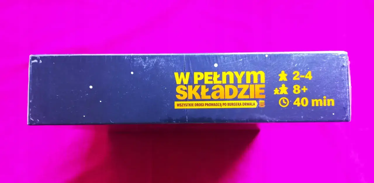 Gra planszowa "W pełnym składzie" dla 2-4 graczy od 8 lat. Czas gry: 40 minut. Wszyscy dążą do zdobycia burgera Drwala!