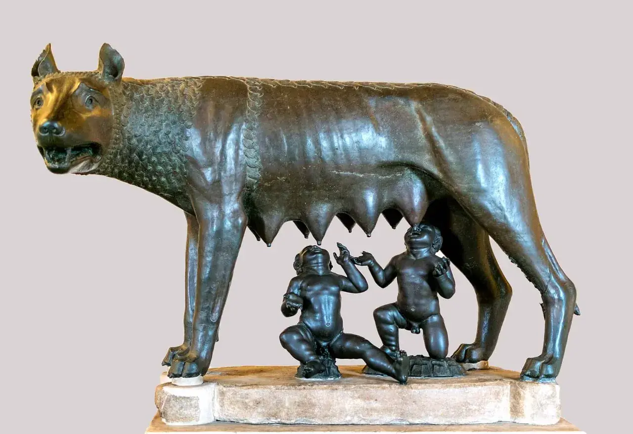 Wilczyca karmiąca Romulusa i Remusa, symboliczna scena z mitologii rzymskiej.