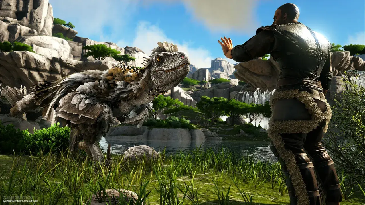 Człowiek w futrzanych strojach wita się z pierzastym dinozaurem. Premiera ark 2.