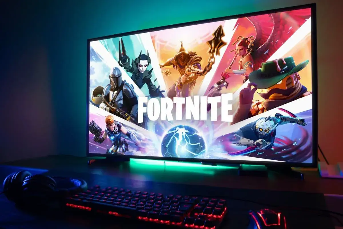 Ekran z logo Fortnite i postaciami. Czas na zmianę nicku Fortnite i rozpoczęcie nowej przygody!