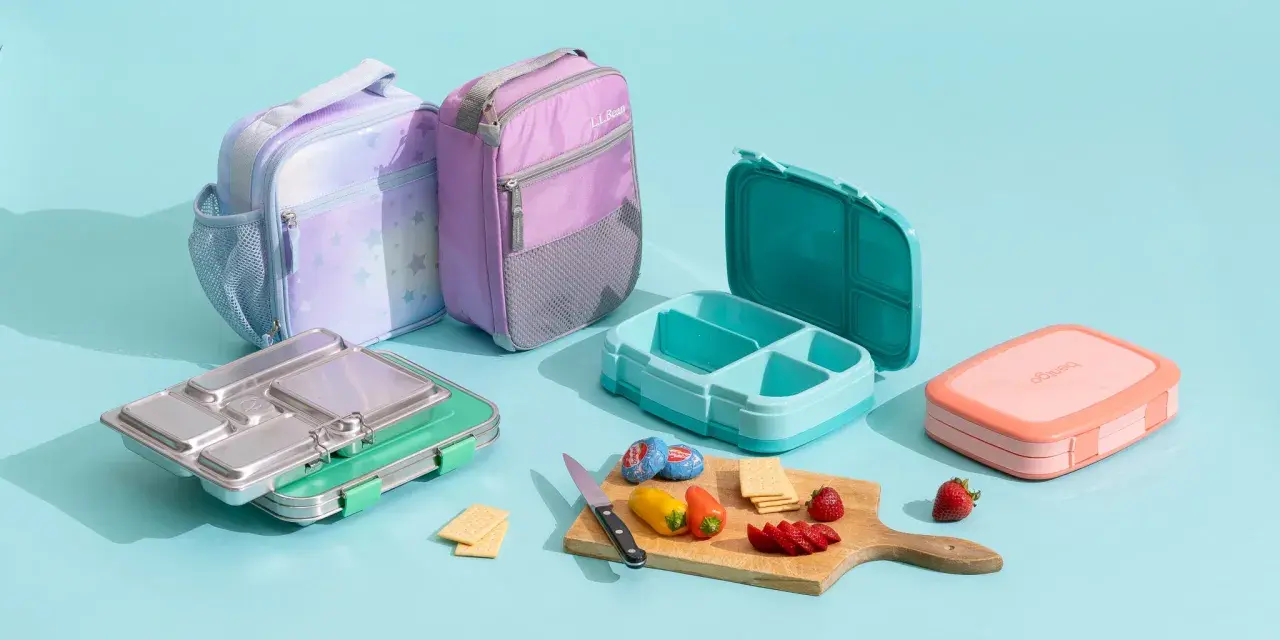 Colorful lunch bags and bento boxes, showcasing what is bento in Japanese: a compartmentalized meal for a balanced lunch.