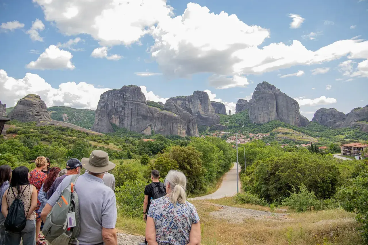 Tourists admire the stunning Meteora price, with its towering rock formations and monasteries.