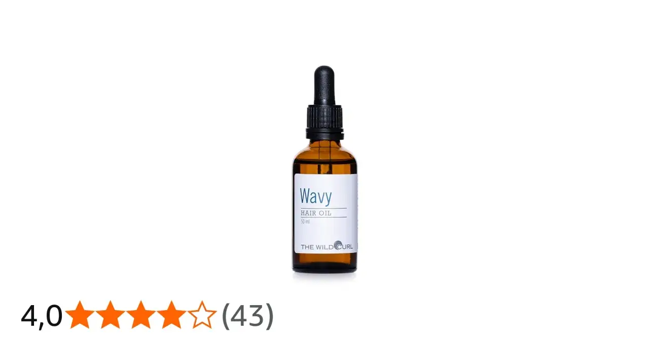 En flaska "Wavy Hair Oil" med pipett, perfekt för att ge näring och glans till torrt hår.