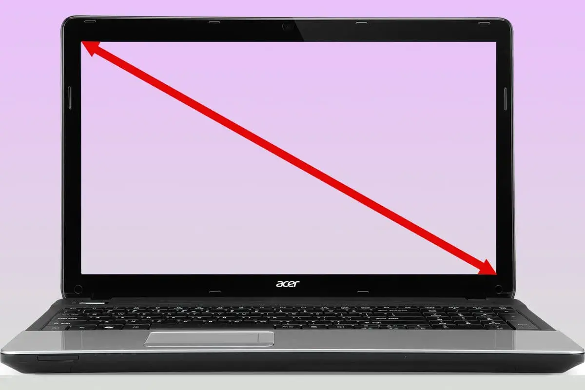 Czerwona linia pokazuje, jak sprawdzić ile cali ma laptop, mierząc po przekątnej ekranu.