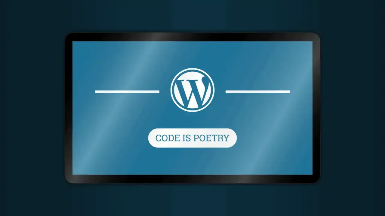Logo WordPress na ekranie tabletu. Pod nim napis "CODE IS POETRY". To jest właśnie wordpress co to.