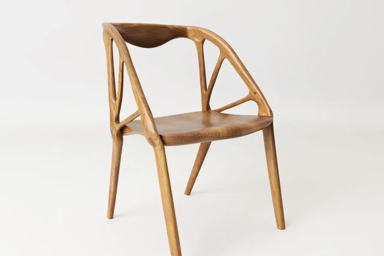 A modern wooden chair with an intricate, skeletal backrest. The chair building showcases organic curves and a light, airy design.