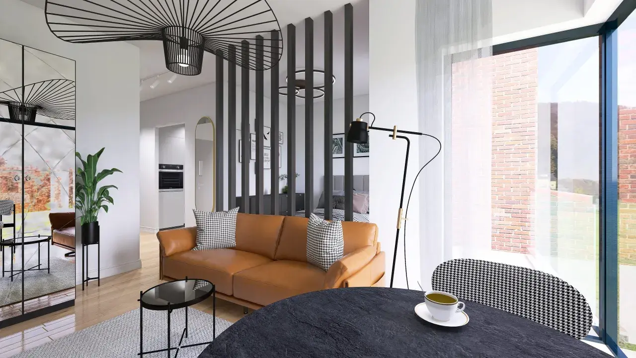 Nowoczesny salon z brązową kanapą i stolikami. W tle kuchnia i sypialnia. Projekt rafin developer.