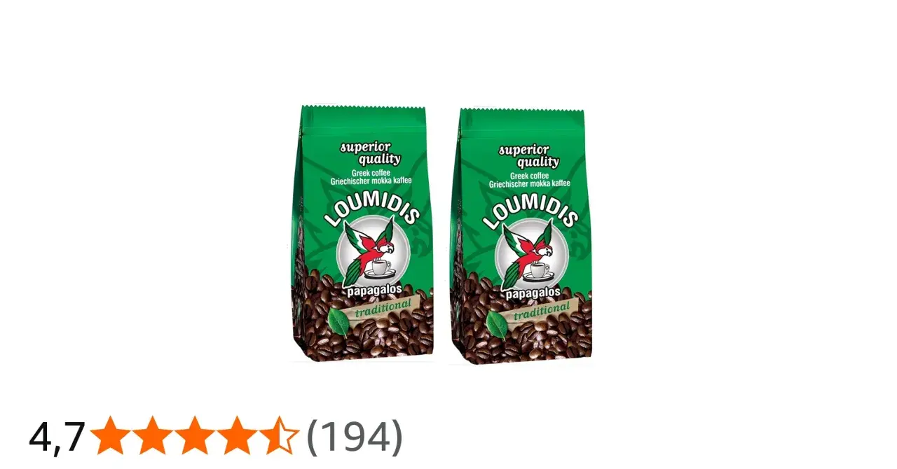 Zwei Packungen Loumidis Kaffee mit Papageien-Logo und Kaffeebohnen. "Superior quality" und "traditional" sind auf den Packungen zu sehen.