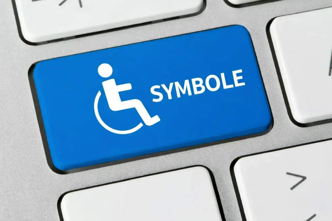 Niebieski klawisz z białym symbolem niepełnosprawności i napisem "SYMBOLE".