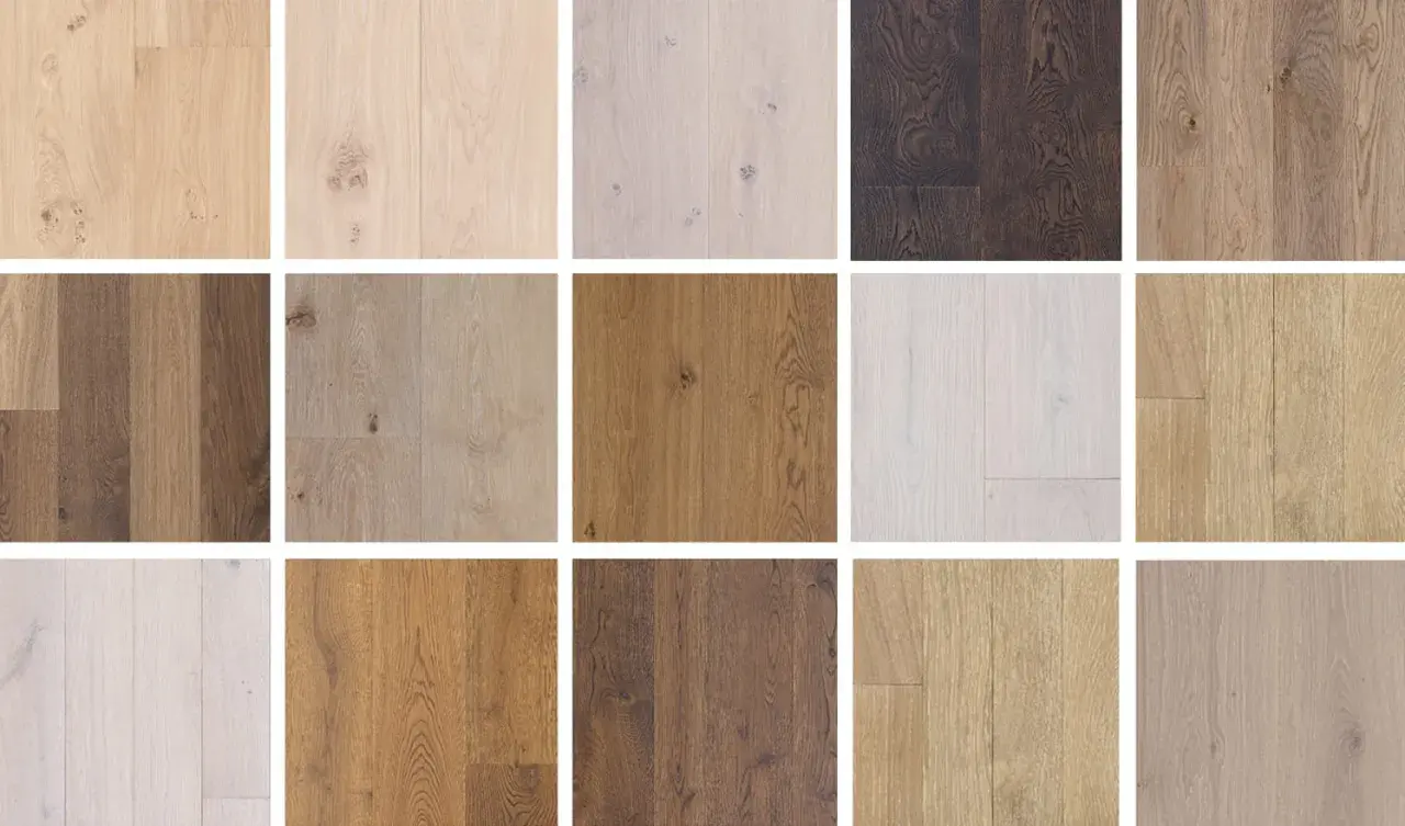 Variedad de tablones de madera de roble en distintos tonos, desde claros hasta oscuros, mostrando la belleza natural del color roble madera.
