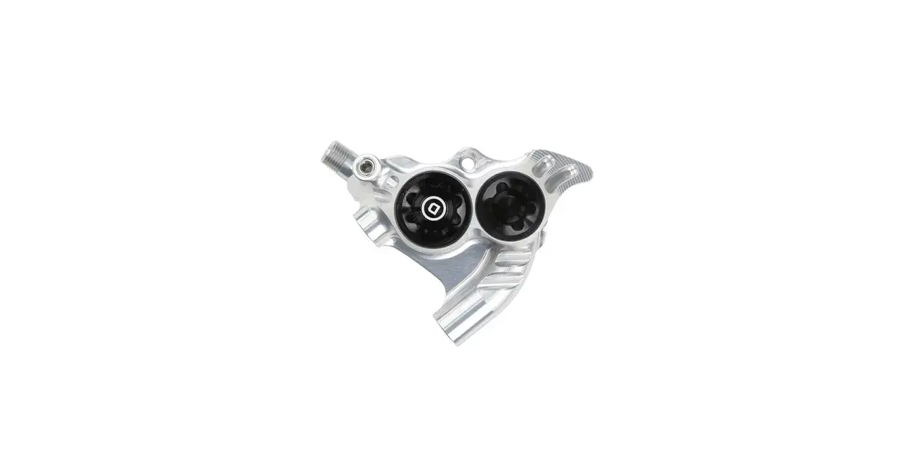 A silver Hope RX4 brake caliper with two black pistons, ready for powerful braking on any trail.