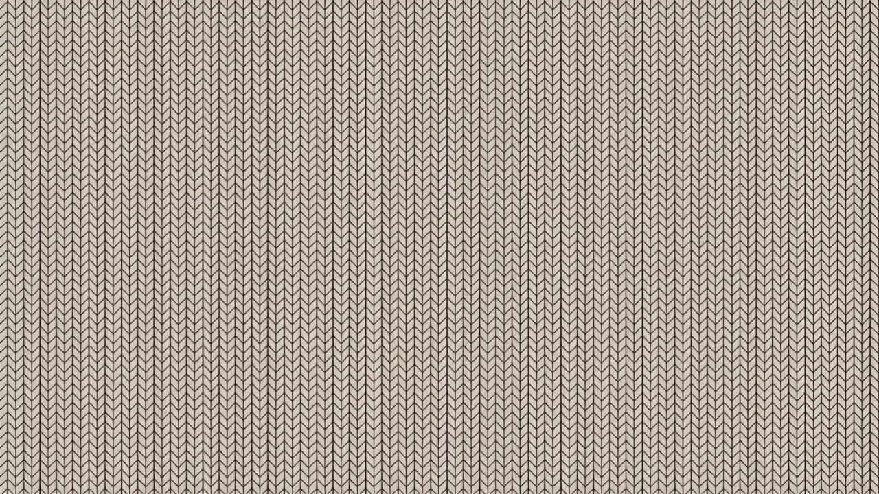 A close-up of a beige knit fabric. The pattern is a series of vertical, V-shaped stitches, creating a ribbed texture.