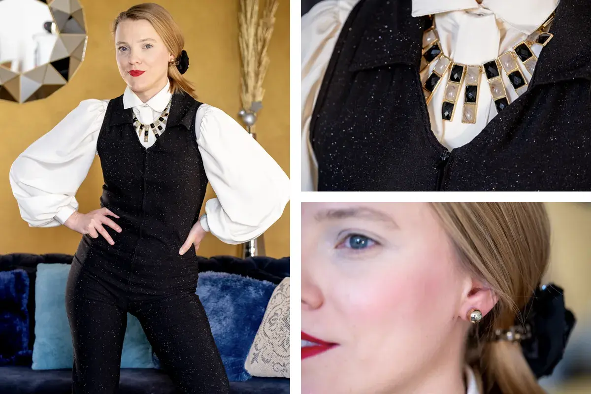 Elegancka kobieta w błyszczącym kombinezonie i naszyjniku, stylizacja inspirowana francuską firmą odzieżową.