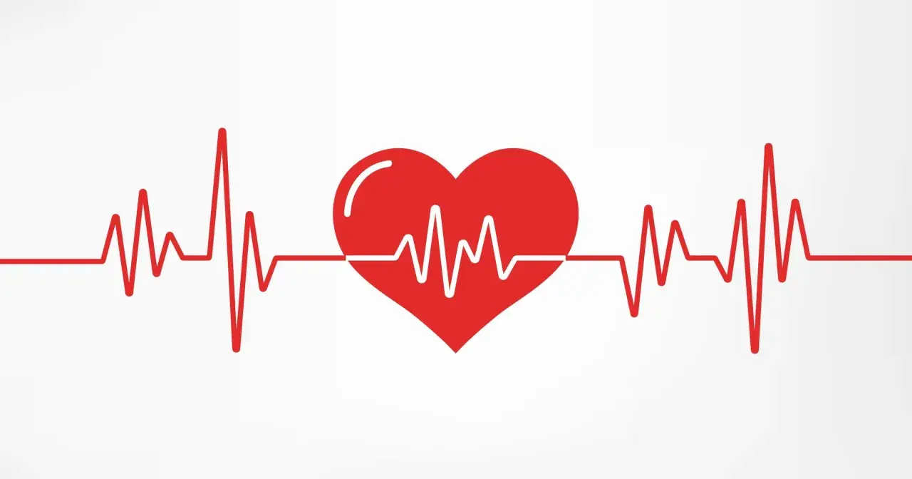 Czerwone serce z linią EKG, symbolizujące zdrowe, choć czasem wysokie tętno.