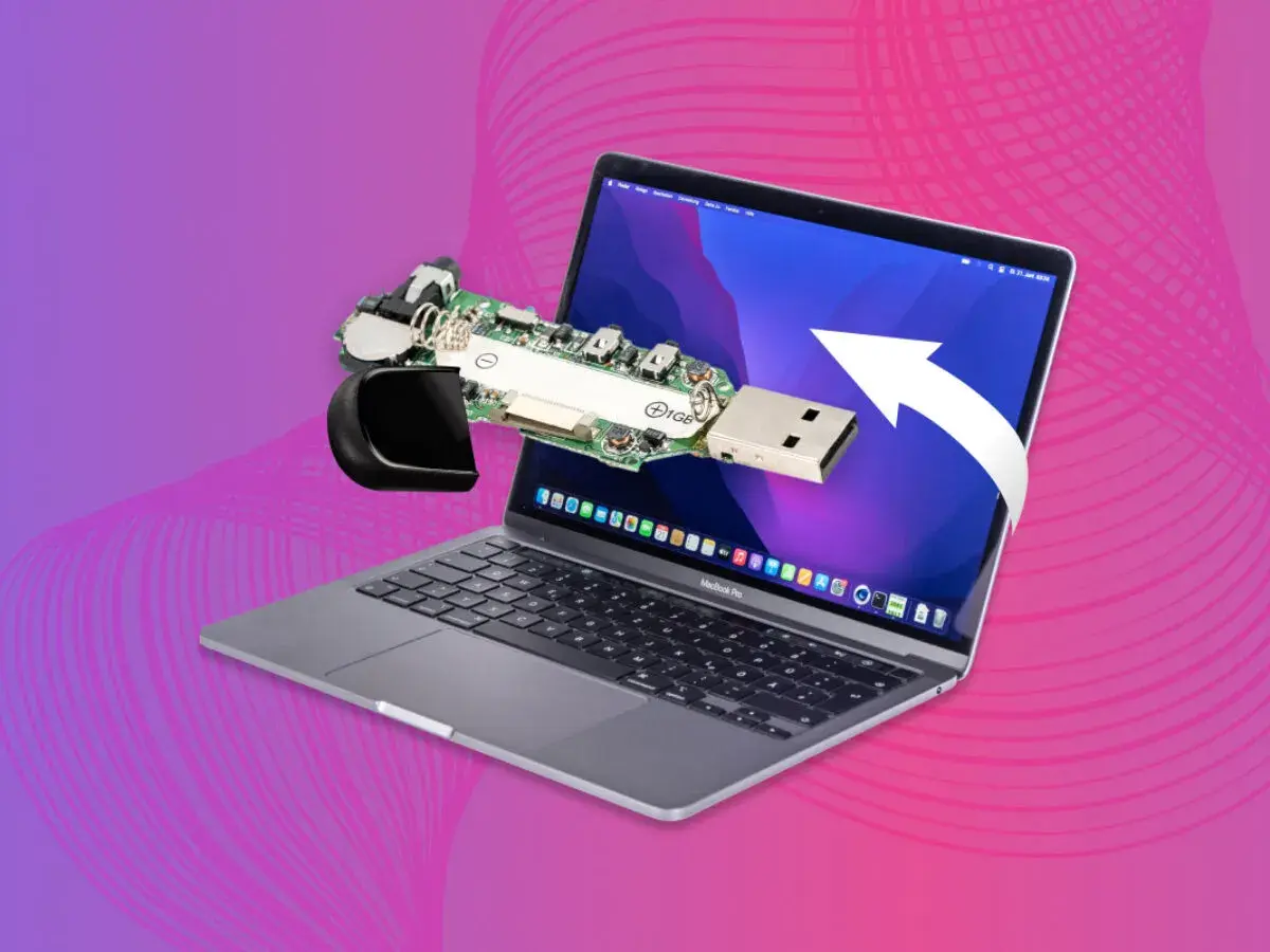 Macbook nie widzi pendrive. Rozłożony pendrive leży na ekranie laptopa, symbolizując problem z odczytem danych.