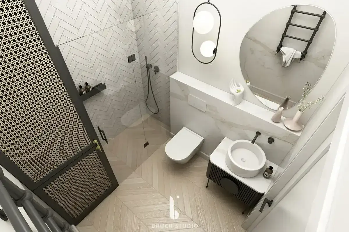 Nowoczesna łazienka z prysznicem, toaletą i umywalką. Wnętrze w jasnych kolorach z akcentami drewna i czarnymi detalami. Idealne miejsce na relaks po całym dniu. Remont łazienki koszt może być zaskakująco przystępny.