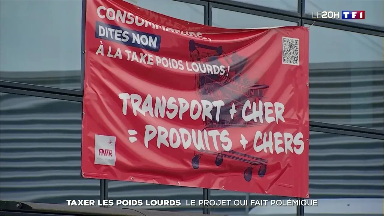 Bannière rouge "Consommateurs, dites non à la taxe poids lourds ! Transport + cher = produits + chers". Document sur la taxe à l'essieu.