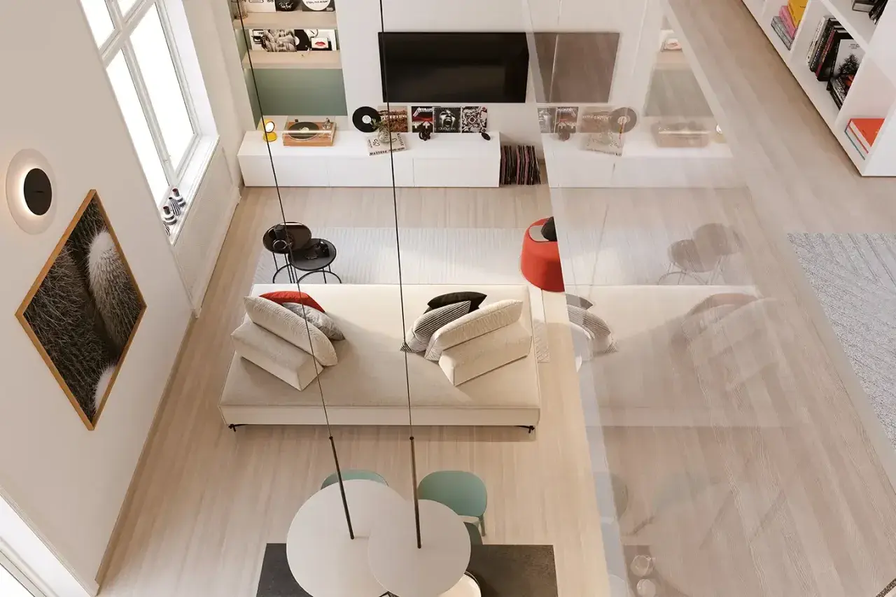 Un angolo di casa moderno e accogliente, perfetto per arredare con stile. Divano bianco, tavolino nero, quadri e giradischi creano un'atmosfera unica.