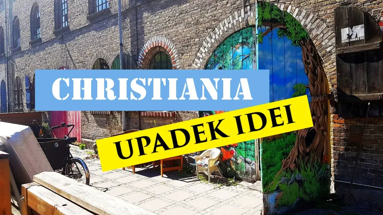 Freetown Christiania, z malowaną bramą i rowerem towarowym.