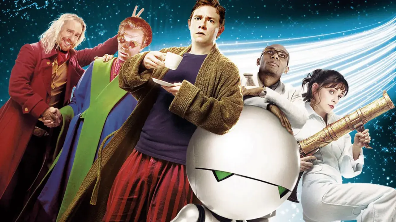 Postacie z filmu "Autostopem przez galaktykę" w kosmicznej scenerii. Arthur Dent z herbatą, Ford Prefect, Zaphod Beeblebrox, Trillian i Marvin.