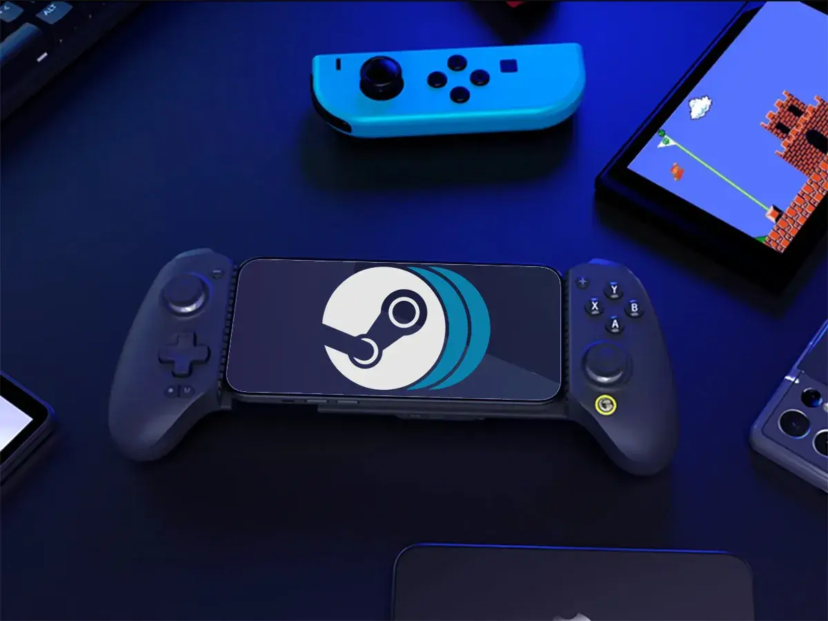 Smartfon z logo Steam w uchwycie gamingowym, idealny do grania w gry z PC na Androidzie. Obok kontroler i ekran z grą retro.