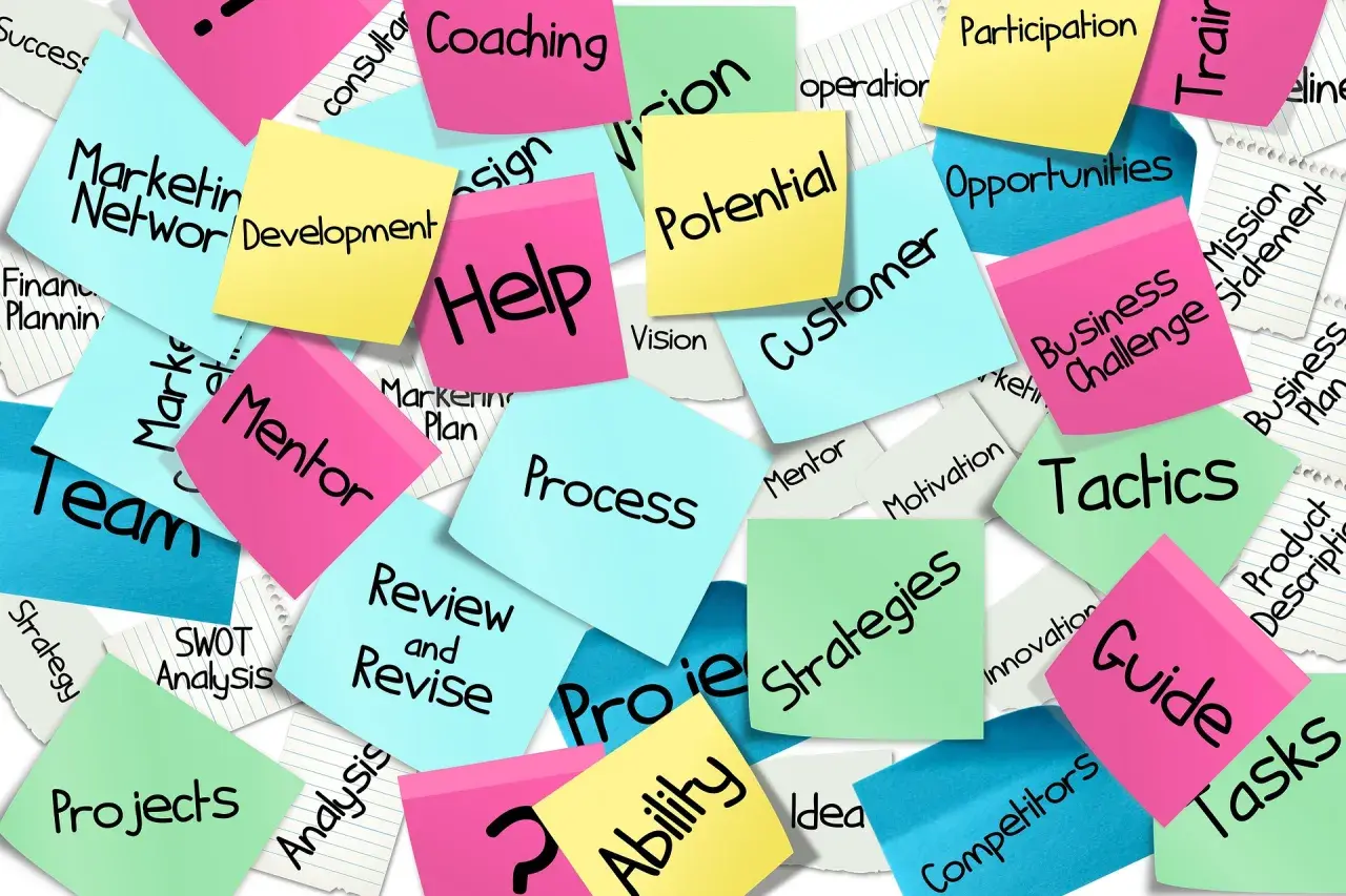 Sticky notes with business terms like "Strategy," "Team," and "Development" offer good survey comments examples for project feedback.