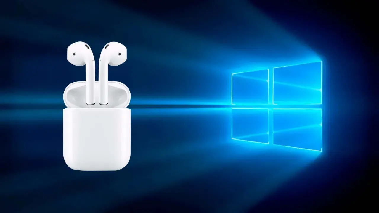 AirPods w etui na tle logo Windows. Czy da się podłączyć AirPods do laptopa? Tak, to możliwe!