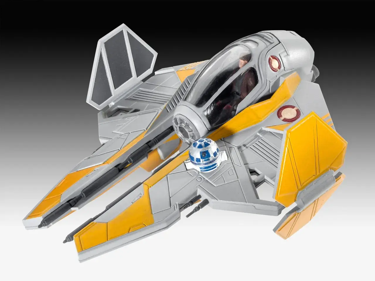Model statku kosmicznego star wars starfighter w kolorze szaro-żółtym, z droidem R2-D2 na pokładzie.