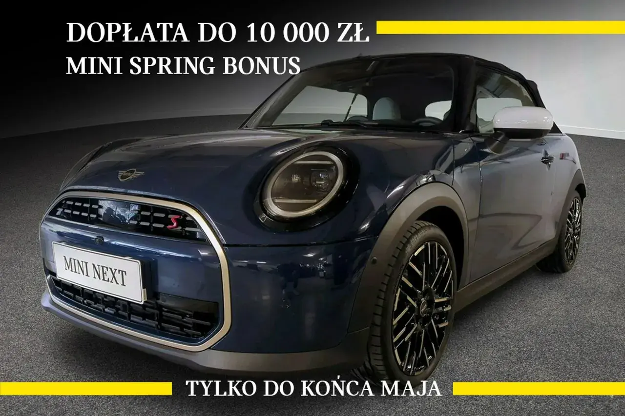 Granatowy Mini Cooper z napisem "MINI SPRING BONUS" i informacją o dopłacie do 10 000 zł. Sprawdź atrakcyjną mini cooper cena!