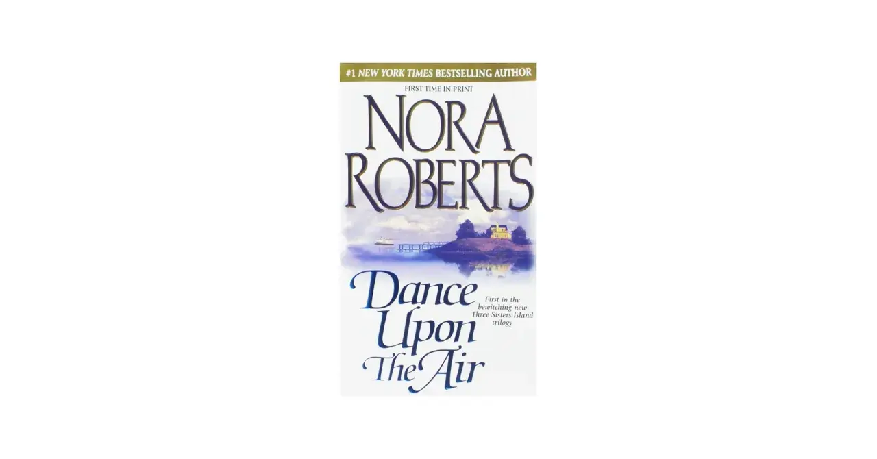Nora Roberts' "Dance Upon The Air" – ein Buchcover mit einer malerischen Insel, die wie eine Insel der Sehnsucht wirkt. Ein Haus und ein Steg sind zu sehen.