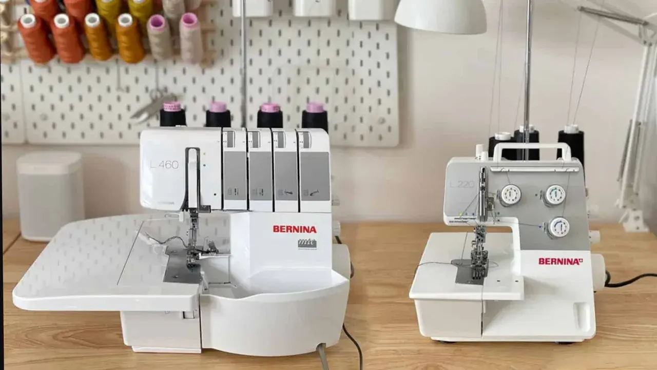 Two Bernina overlock machines, a serger vs overlock comparison, sit on a wooden table.